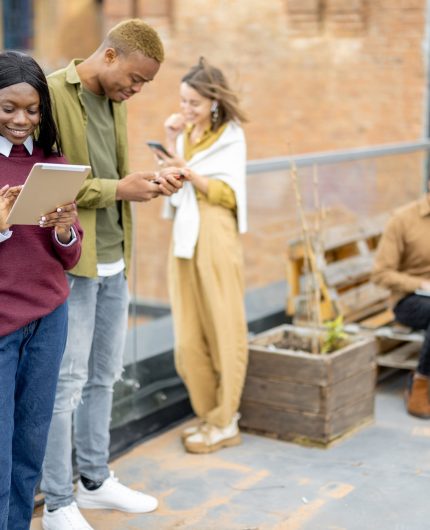 Students use digital devices at university campus